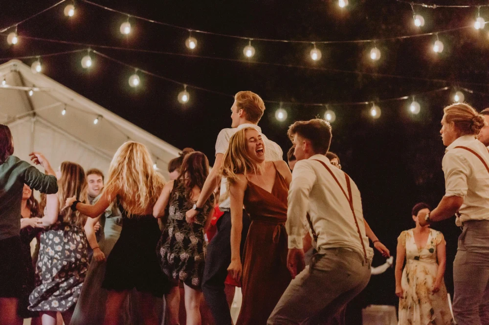 a group of people dancing on a dance floor