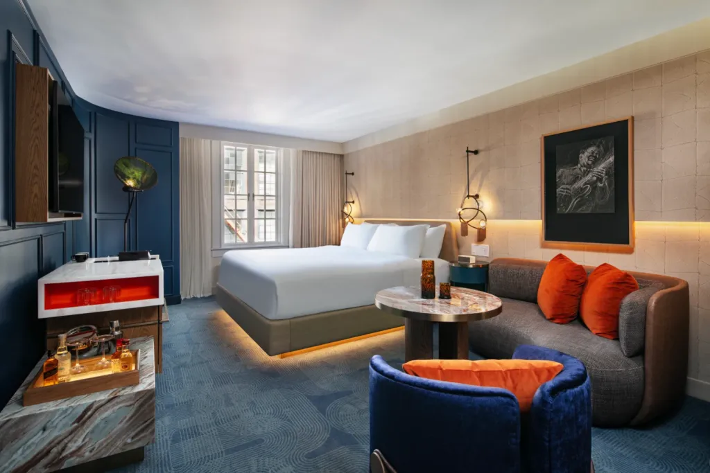 a hotel room with a bed and a couch