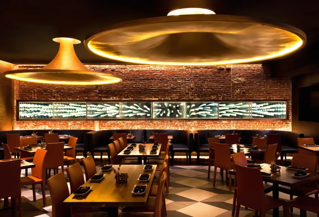 a restaurant with a checkered floor and a brick wall